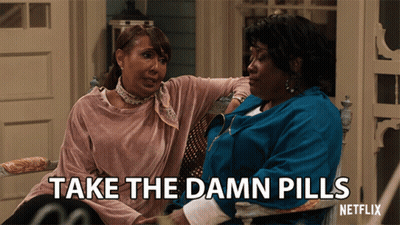 Two Women On Porch Saying Take The Damn Pills GIF