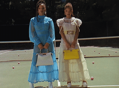 Two Women On Tennis Court With Yellow Bag F GIF