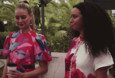 Two Women One Holding Coffee GIF