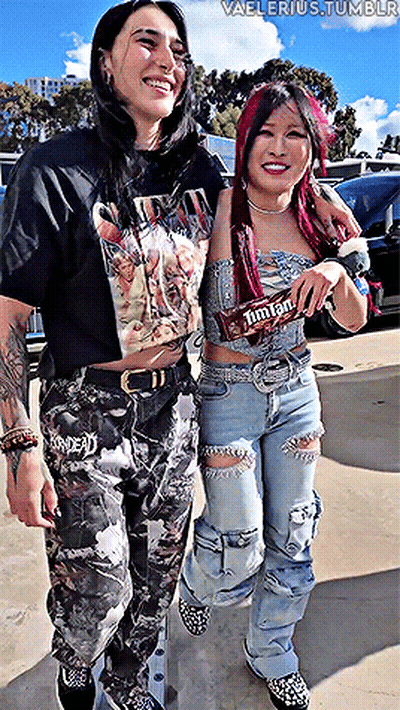 Two Women One Holding M&M's Candy Bar GIF