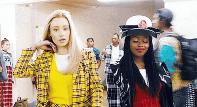 Two Women One In Yellow Plaid Jacket GIF