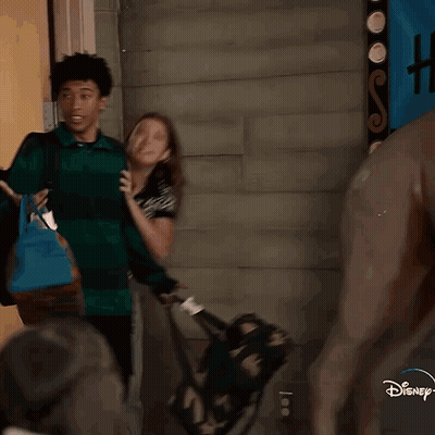Two Women One Wearing Disney Shirt GIF