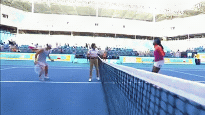 Two Women Playing Tennis GIF