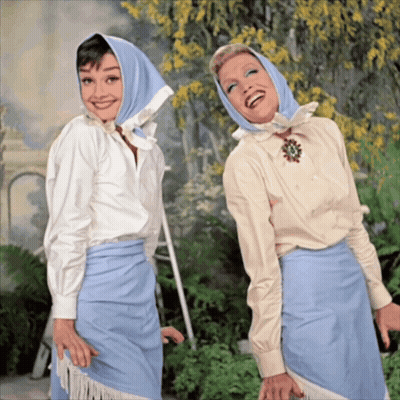 Two Women Posing One With Blue Scarf GIF