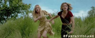 Two Women Running Through A Grassy Field With The Hashtag #Fantasyisland GIF