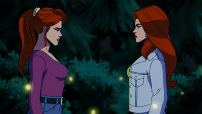 Two Women Shaking Hands In Front Of A Forest GIF