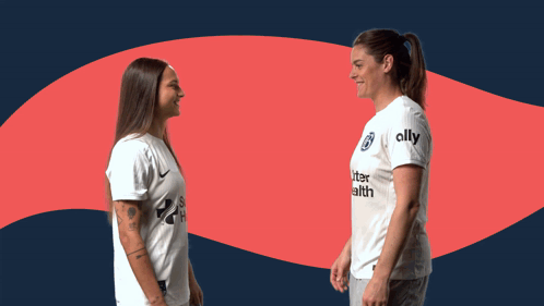 Two Women Shaking Hands With One Wearing A Shirt That Says Ally On It GIF