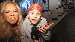 Two Women Shouting Outside Building GIF