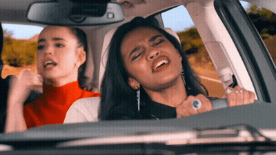 Two Women Singing In Car GIF