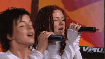 Two Women Singing Into Microphones At NBC Keyboard GIF