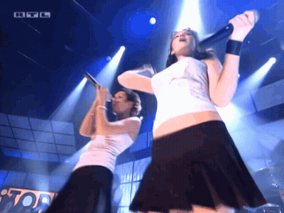 Two Women Singing On Stage RTL Logo GIF