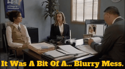 Two Women Sit At A Desk Talking To A Man With The Words It Was A Bit Of A Blurry Mess Above Them GIF