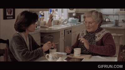 Two Women Sit At A Table With A Gifrun.com Watermark On The Bottom Right GIF