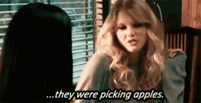 Two Women Sitting At Table One Says Picking Apples GIF