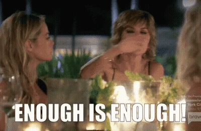 Two Women Sitting At Table Saying Enough Is Enough GIF