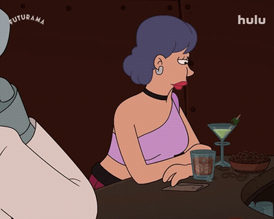 Two Women Sitting At Table With Who Me GIF