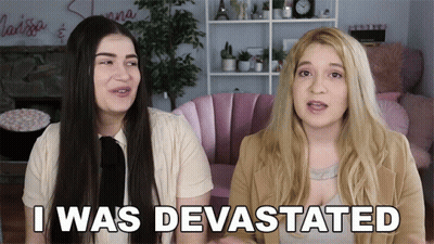 Two Women Sitting Devastated GIF