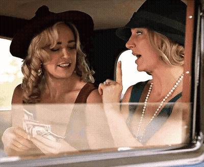 Two Women Sitting In Car With Money GIF