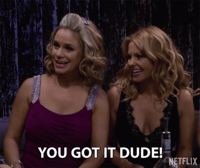 Two Women Sitting Next To Each Other GIF
