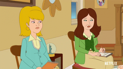 Two Women Sitting Next To Each Other GIF