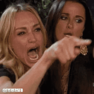 Two Women Sitting Next To Each Other GIF