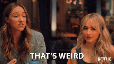Two Women Sitting Next To Each Other Saying That's Weird GIF