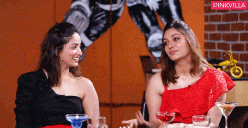 Two Women Sitting Next To Each Other With A Pinkvilla Logo In The Background GIF