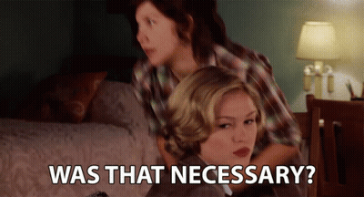 Two Women Sitting On Bed Saying Was That Necessary GIF