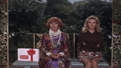 Two Women Sitting On Bench With Congratulations Gift Box GIF