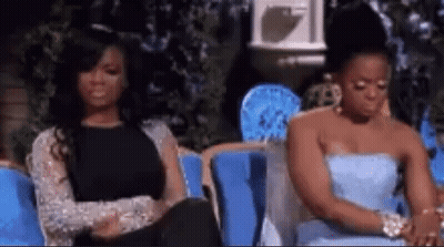 Two Women Sitting On Couch GIF
