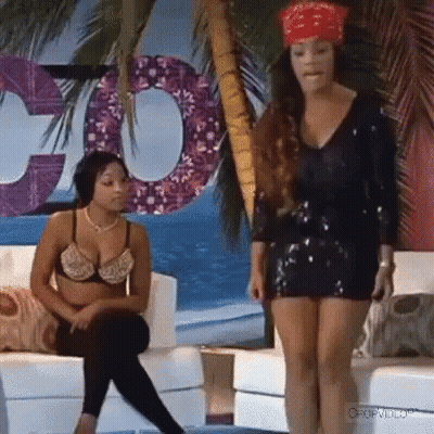 Two Women Sitting On Couch One With Bandana GIF