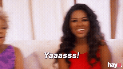 Two Women Sitting On Couch Saying Yaaasss GIF