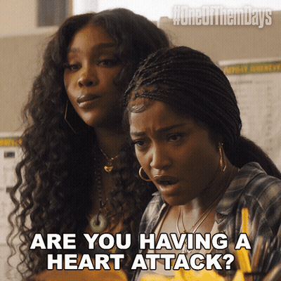 Two Women Sitting One Asking About Heart Attack GIF