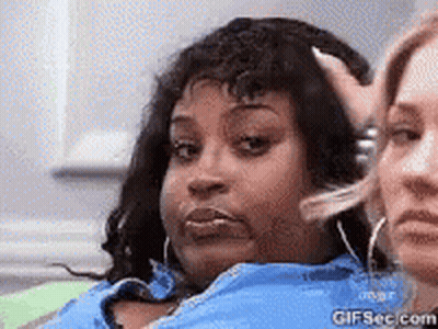 Two Women Sitting One Hand To Head GIF