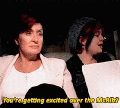 Two Women Sitting One Says You're Getting Excited Over The McRib GIF