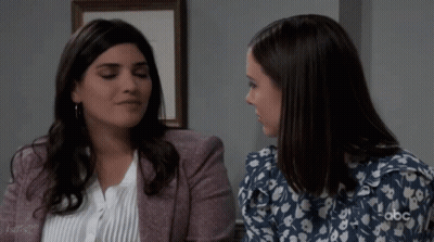 Two Women Sitting, One With ABC Logo GIF