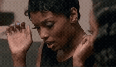 Two Women Sitting Together On A Couch GIF