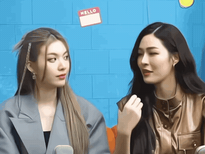Two Women Sitting With Hello Name Tags GIF