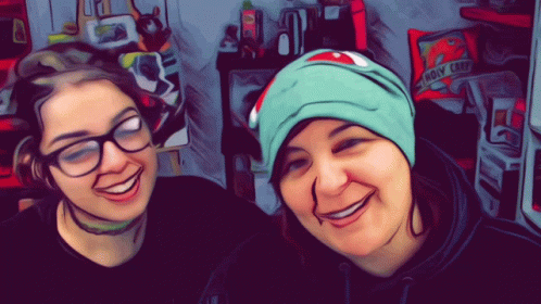 Two Women Smiling In Front Of Bag That Says Holy Crap GIF