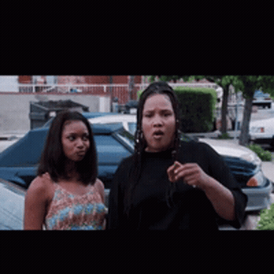 Two Women Standing By Car In Parking Lot GIF