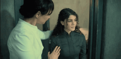 Two Women Standing In Doorway GIF
