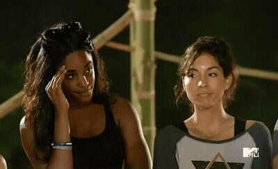 Two Women Standing In Front Of MTV Screen GIF