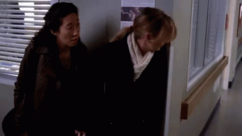 Two Women Standing In Hospital Hallway GIF