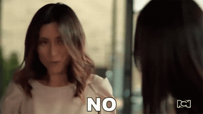 Two Women Standing Next To Each Other GIF