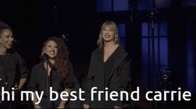 Two Women Standing Next To Each Other GIF