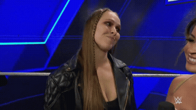 Two Women Standing Next To Each Other GIF
