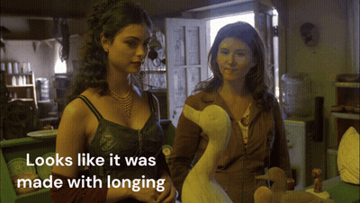 Two Women Standing Next To Each Other Looks Like It Was Made With Longing GIF