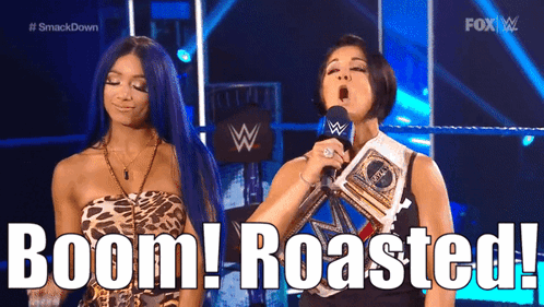 Two Women Standing Next To Each Other On A Stage With The Words Boom Roasted Behind Them GIF