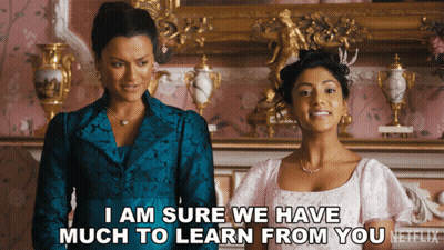 Two Women Standing Next To Each Other Saying I Am Sure We Have Much To Learn From You GIF