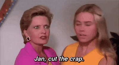 Two Women Standing Next To Each Other Talking GIF
